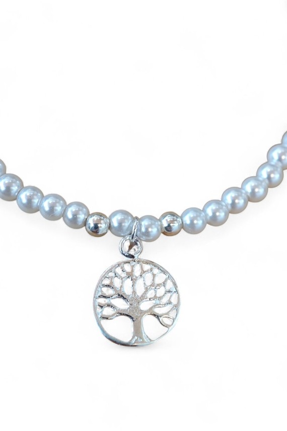 Pulsera en plata de ley con bolitas de perla y colgante Árbol de la Vida, símbolo de fuerza y crecimiento. Pulsera en plata de ley con bolitas de perla y colgante Árbol de la Vida, símbolo de fuerza y crecimiento.
