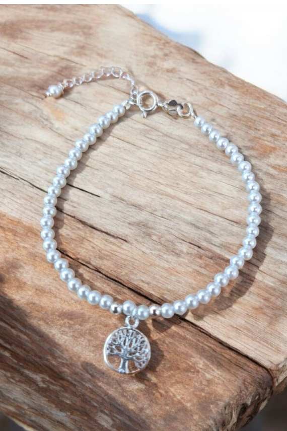 Pulsera en plata de ley con bolitas de perla y colgante Árbol de la Vida, símbolo de fuerza y crecimiento. Pulsera en plata de ley con bolitas de perla y colgante Árbol de la Vida, símbolo de fuerza y crecimiento.
