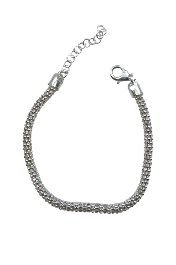 “Pulsera de plata con cordón trenzado y acabado brillante, diseño atemporal Samarkanda.”