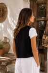 Chaleco floral negro de viscosa y lino con motivos blancos y forro de algodón Samarkanda